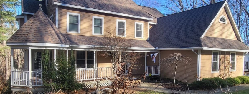 A large house in Chester featuring a spacious porch and an expansive yard.