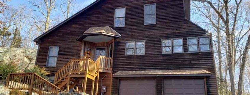 A large house in Chester featuring a spacious porch and an expansive yard.