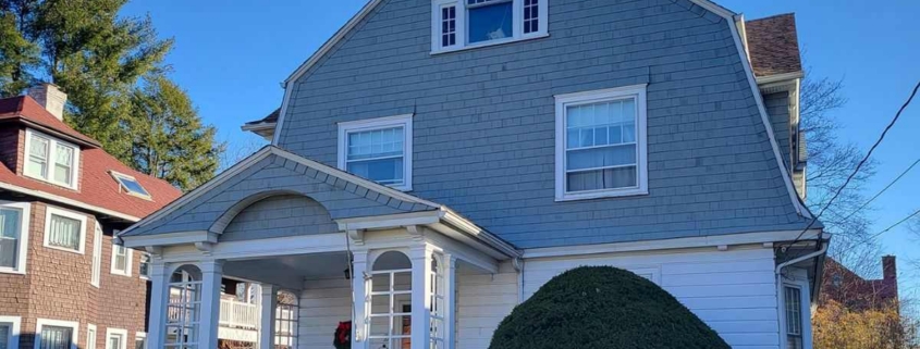 Charming house with front porch and inviting outdoor space.