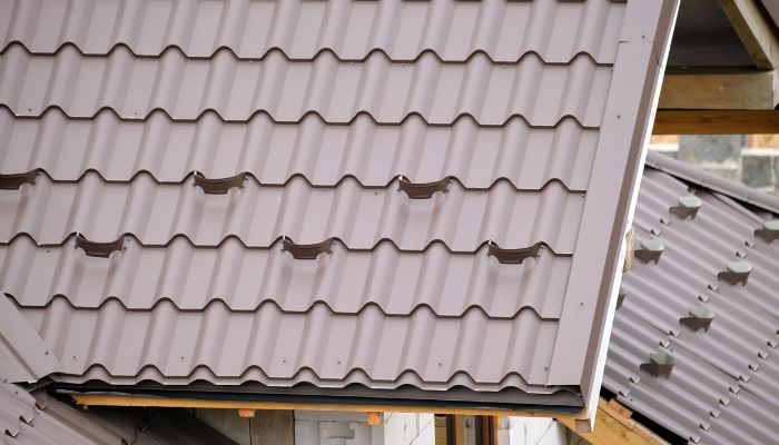 A newly installed metal roof with visible ridges and edges on a modern home.