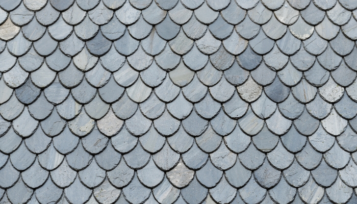 Close-up of a blue roof showcasing various shapes, highlighting the unique design of slate roofing in Connecticut.