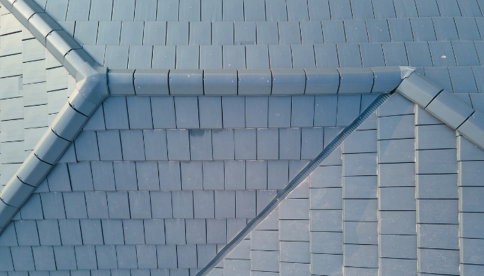 A triangular-shaped roof with a white surface, illustrating synthetic slate roofing options for Connecticut homeowners.