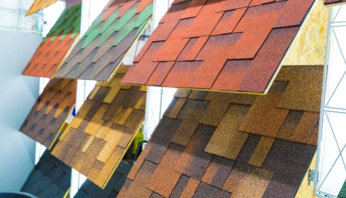 Different colored shingles arranged for display, highlighting choices for roof repair or replacement in Connecticut.