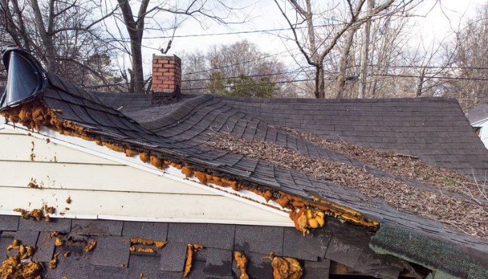 A sagging roof with visible sagging damage highlighting repair needs in Connecticut.