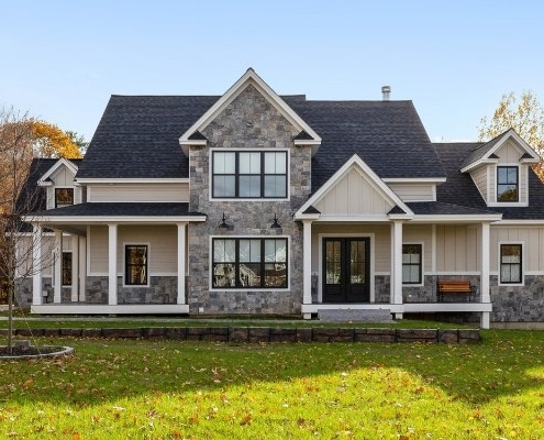Stone exterior home with wide porch, Connecticut siding styles