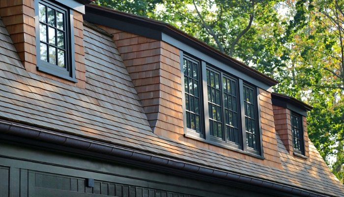 Close-up of a house roof featuring cedar siding and windows, highlighting its natural beauty and curb appeal.