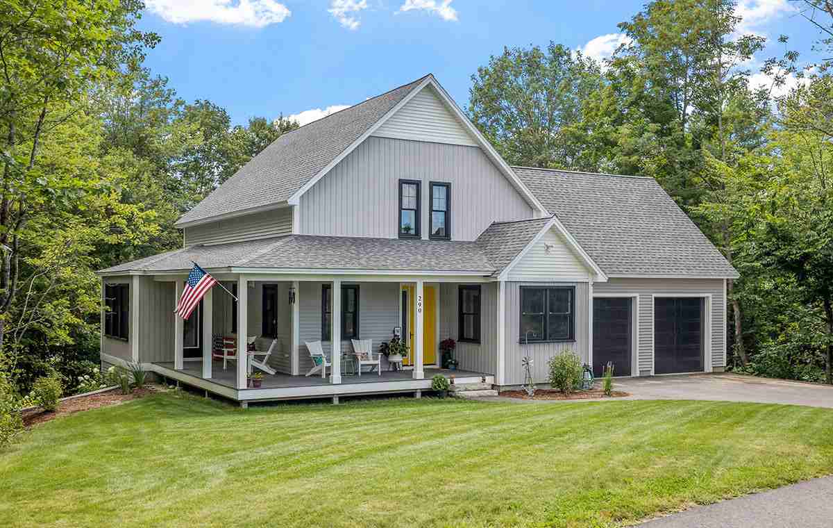 Gray home with porch and flag in New Canaan CT.