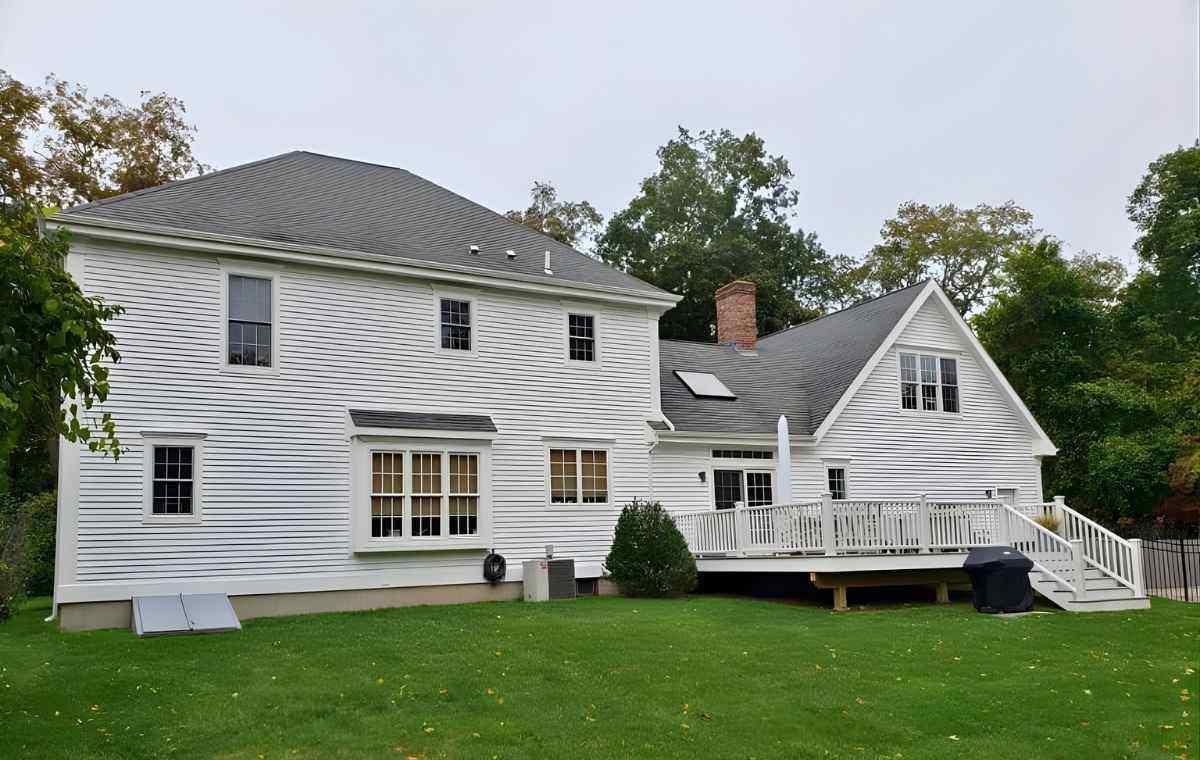 White vinyl siding repair on residential home with clean exterior finish in Connecticut