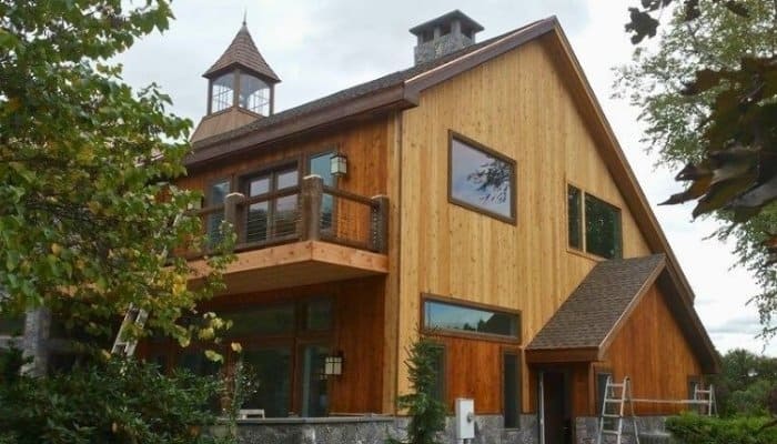 Engineered wood siding on a custom New England home with natural wood finish