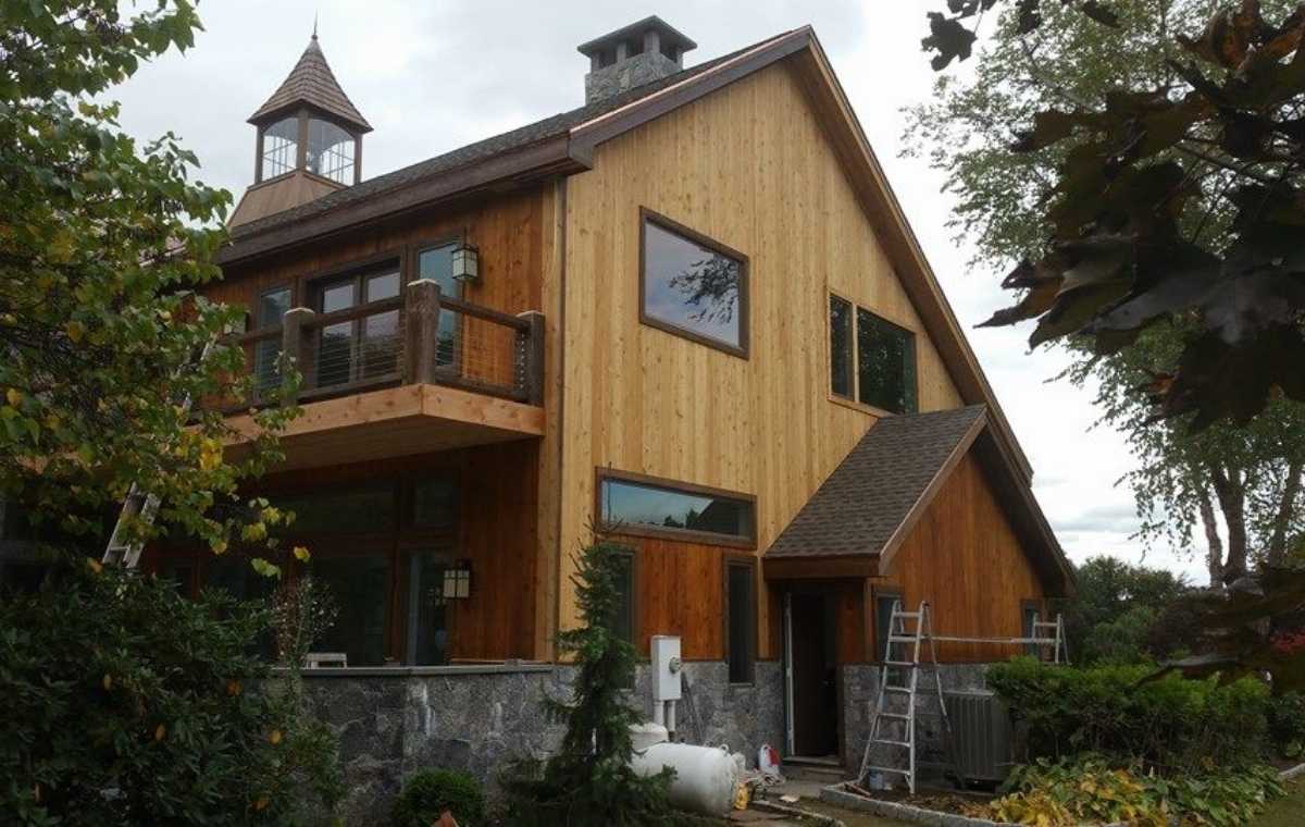 Wood siding contractor project on a Connecticut home with dark brown wood siding