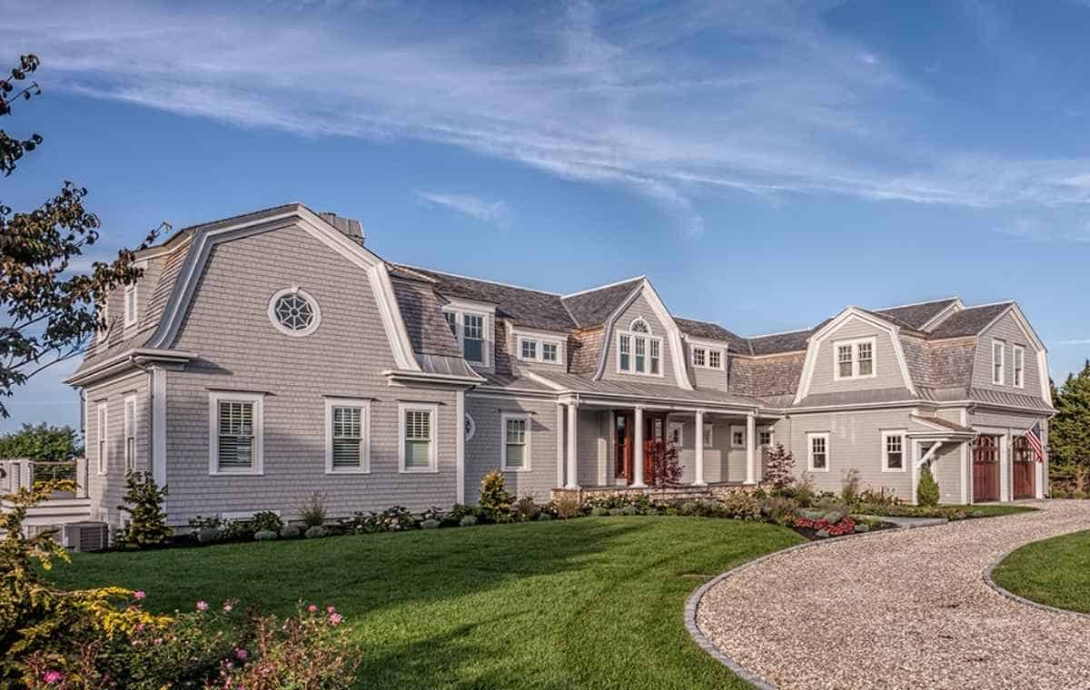 Cedar shake siding installation on a luxury Connecticut home exterior