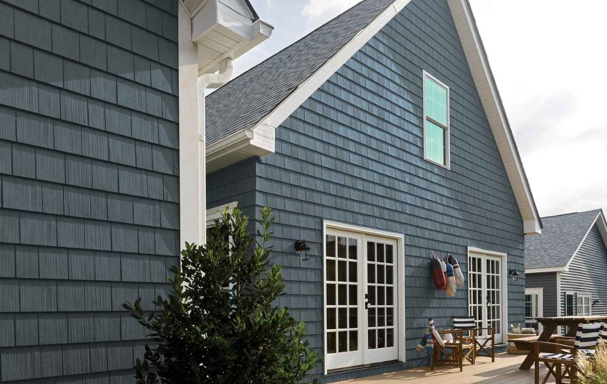 NuCedar siding in CT with dark gray shingle siding and white trim.